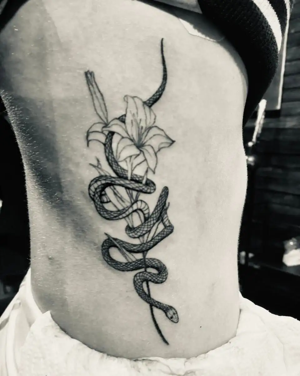 Flowers and Snake Combo Tattoo on Women's Rib