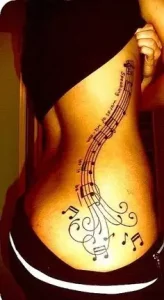 Music-themed Side Rib Cage Tattoo