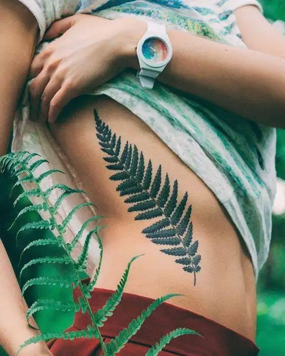 Nature-inspired Ribcage Ink Side Tattoo